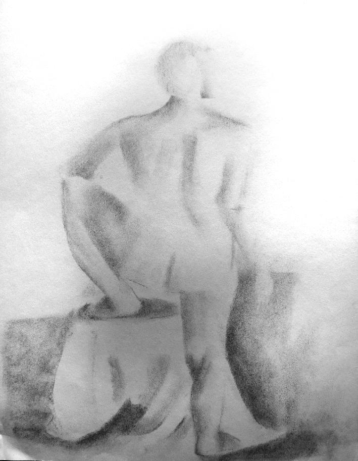 One foot on draped box